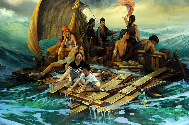 3D art China: People pose with a 3D painting exhibition in Hangzhou