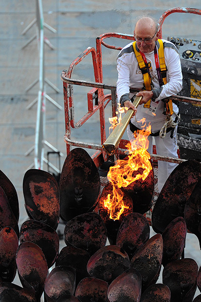 Olympic cauldron: Olympic Torchbearer Austin Playfoot lights the Olympic Cauldron