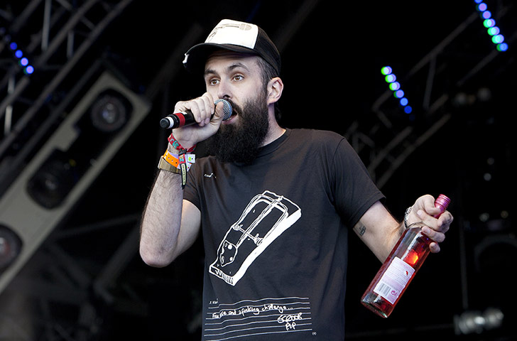 Camp Bestival day three: Scroobius Pip performs with a bottle of rosé