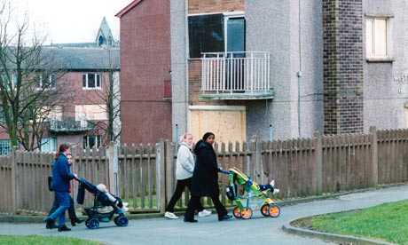 Women walking their babies in buggys on council housing estate Bradford Yorkshire UK