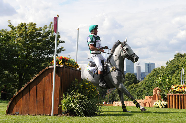 equestrian4: Serguei Fofanoff of Brazil riding Barbara goes around fence 20b