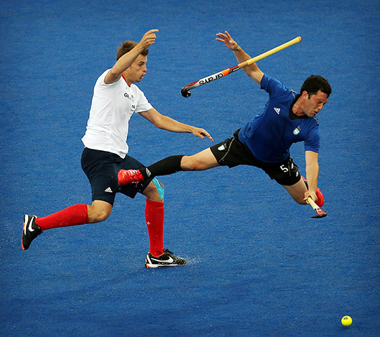 Hockey: Matt Daly of Great Britain collides with Pedro Ibarra of Argentina 
