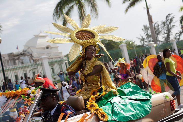 Carnival of flowers: A Carnival Queen blows a kiss onlookers