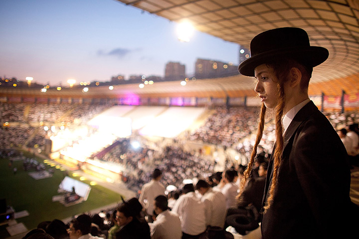 24 hours: Jerusalem: A boy looks on at Siyum Hashas celebrations