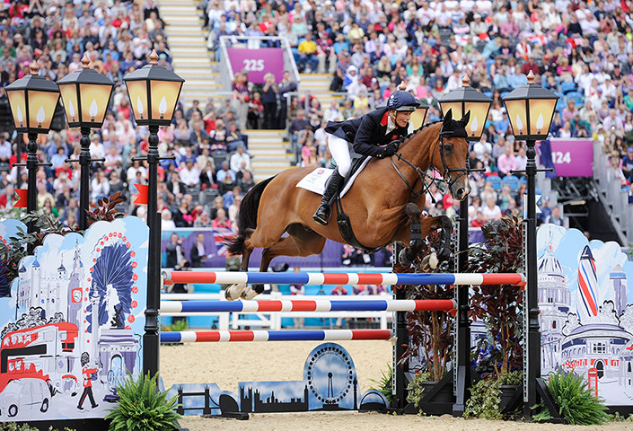 Equestrian jumping: Mary King jumps the London Montage fence on Imperial Cavalier