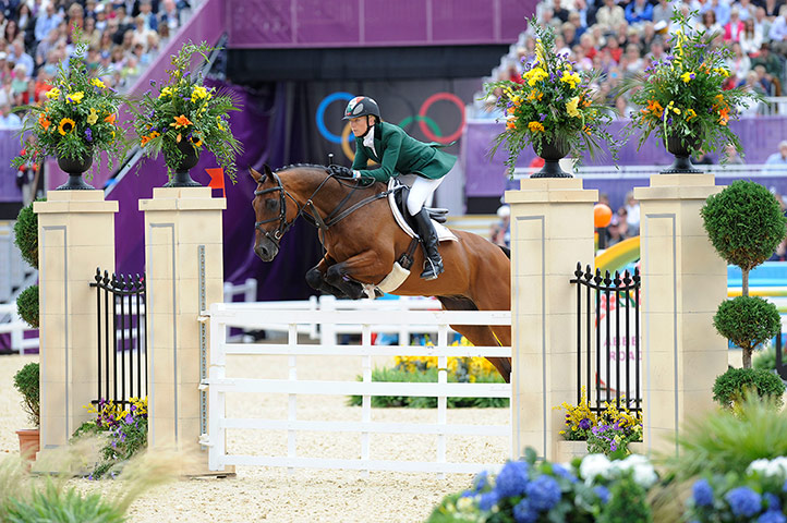 Equestrian jumping: An Irish rider goes over the English Country Gate jump