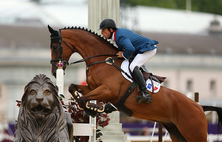 Jumps in Greenwich Park: Aurelien Kahn of France rides Cadiz over the Trafalgar Square fence