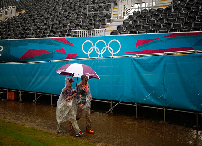 Quiet London: People walk past empty spectator stands