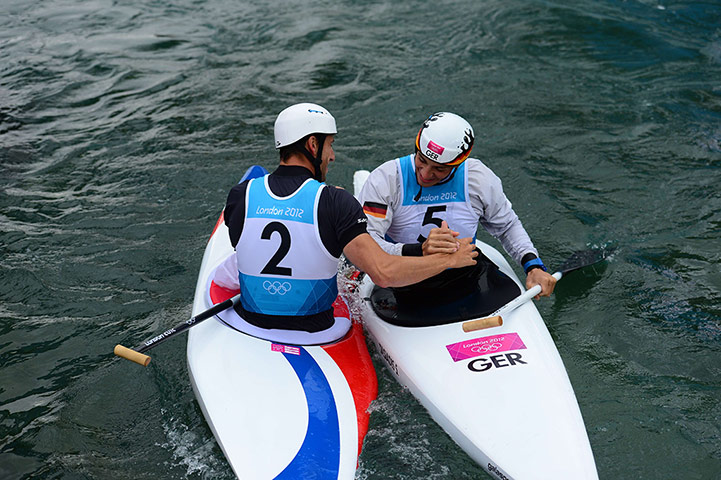 Canoe slalom: France's gold medalist Tony Estanguet shakes hands with Sideris Tasiadis 