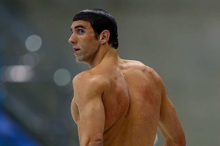 200m butterfly: Michael Phelps leaves the pool after winning the silver 