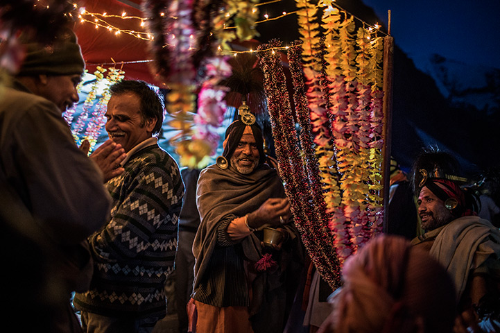 FTA: Daniel Berehulak: Hindu holy men and pilgrims celebrate at a campsite during their pilgrimage
