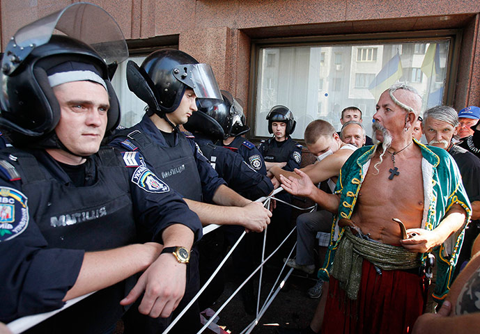 Picture Desk Live: An opposition supporters, dressed in traditional Cossack clothes