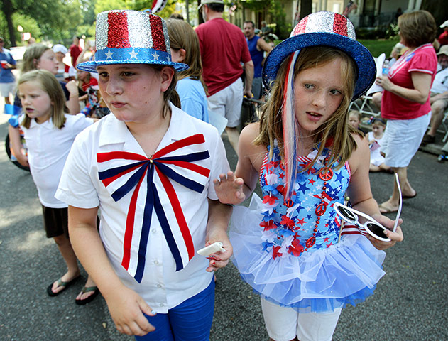 Fourth July 2012: Maggie Hughs, 10, and Mary Chapman Morrow, 10, listen for the winners
