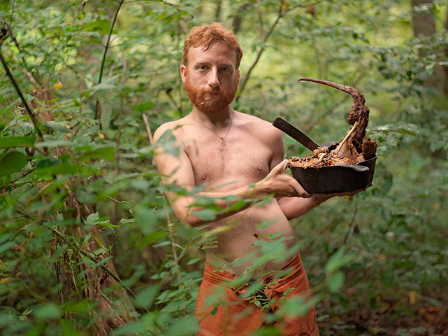 Rencontres Arles: A man in forest holding a pan of food