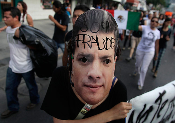 Picture Desk Live: Member of I am 132 movement takes part in demonstration