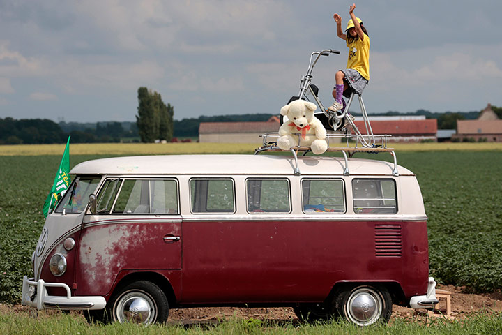 24 hours in pictures: A young fan sits waiting for the Tour de France