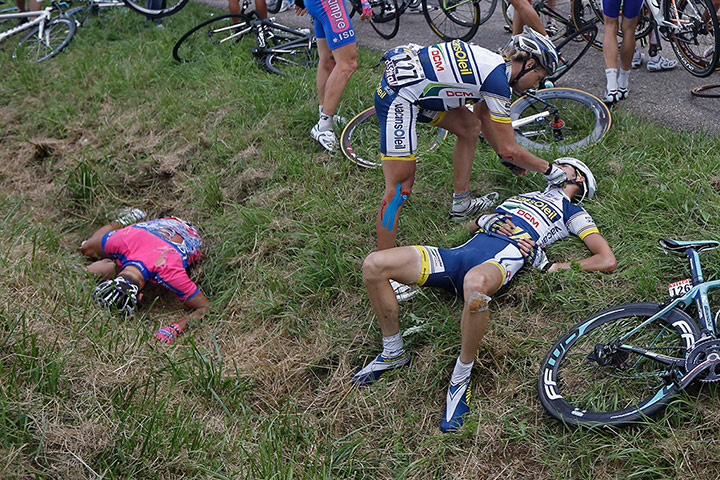 24 Hours: Rob Ruijgh tends to Wouter Poels after a crash during the Tour de France
