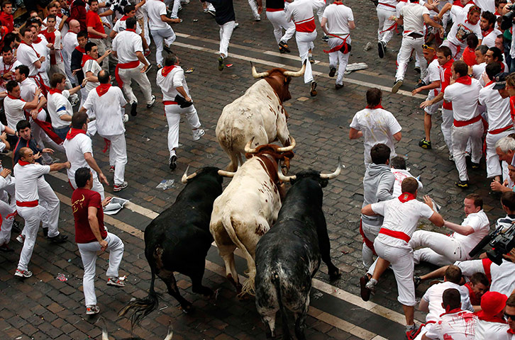 Pamplona: The bulls are let on to the street amongst the runners