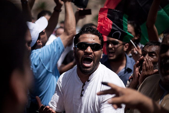 Libya election: A Libya man chants revolutionary slogans while celebrating