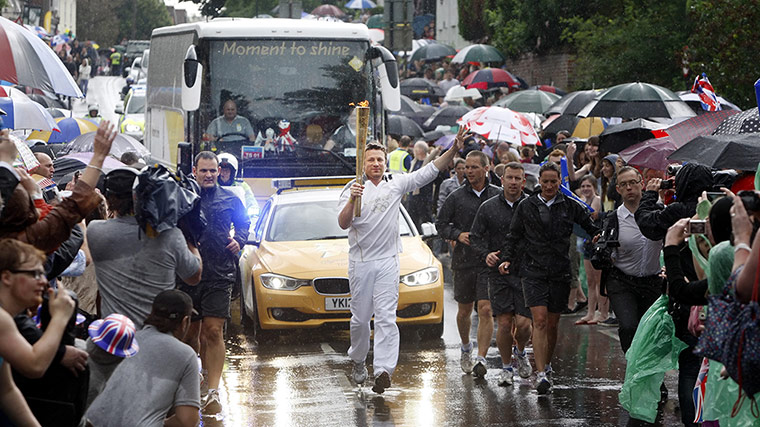 Olympic flame: TV Chef Jamie Oliver carries the flame between Newport and Saffron Walden