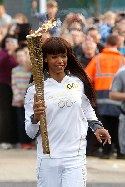 Olympic flame: Moesha Howard, Torchbearer 001, carries the Olympic Flame in Chelmsford