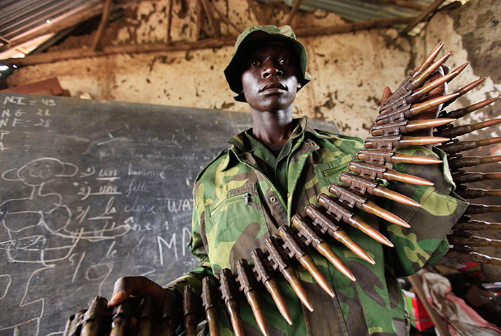  24 hours: Bunagana: A Congolese rebel fighter shows arms captured from fleeing army 
