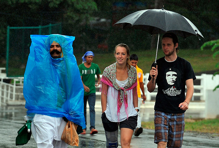Picture Desk Live: Cricket fans walk outside The Pallekele