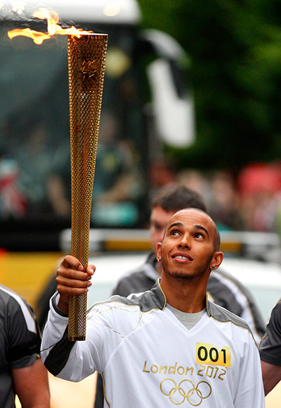Picture Desk Live: Lewis Hamilton carries the Olympic torch