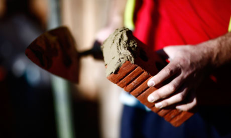 Brick layer works on construction of new homes