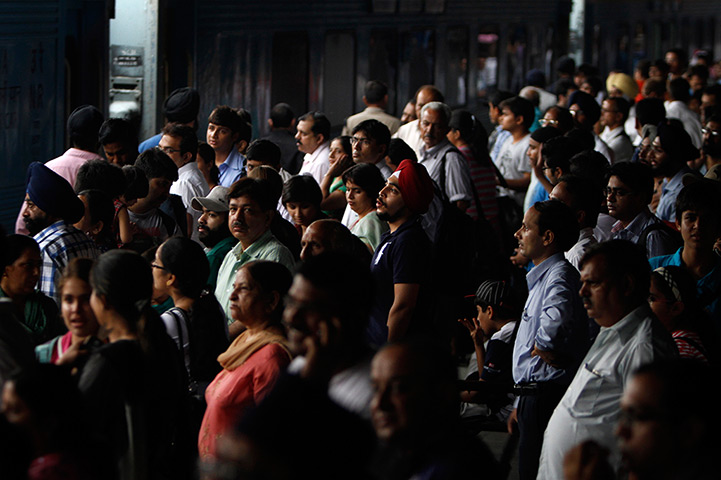 India blackout ends: Stranded passengers wait for power at New Delhi railway station