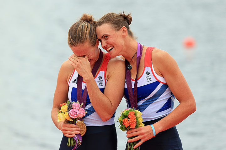 Glover and Stanning: Helen Glover is overcome by emotion as the pair stand on the podium 