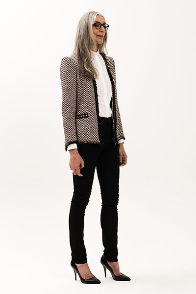 All Ages: White: Model wears white shirt and black trousers and patterned jacket