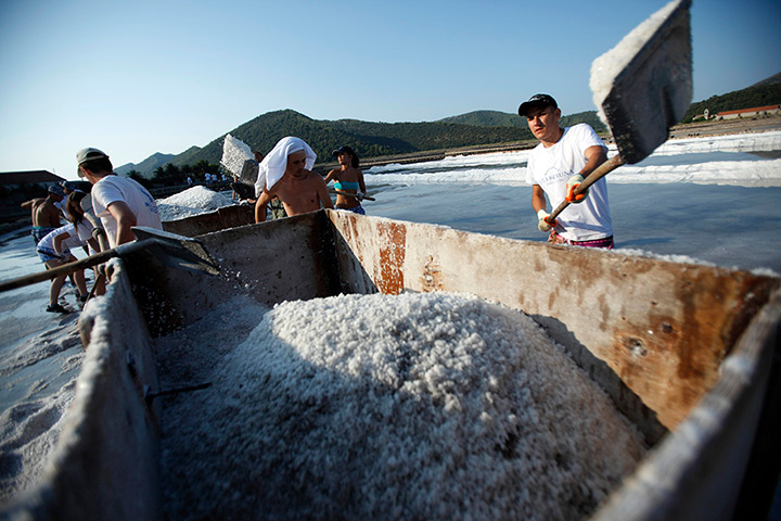 24hours in pictures: Workers collects salt at the Ston Saltworks site