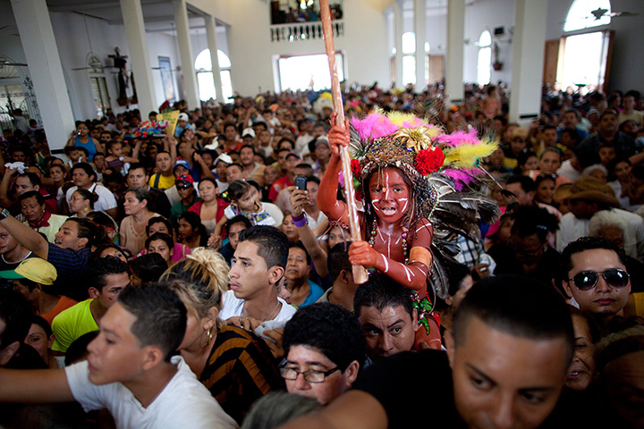 24hours in pictures: A boy dressed as an indigenous child during celebrations