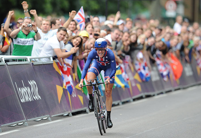 Tom Jenkins Time trial: Kristin Arsmtrong of USA crosses the finish line to win gold