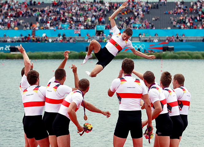 Olympic reactions: Germany's coxswain Martin Sauer is thrown into the water
