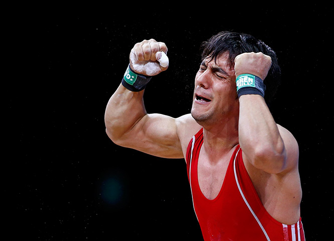 Olympic reactions: Azerbaijan's Sardar Hasanov reacts after failed lift weightlifting