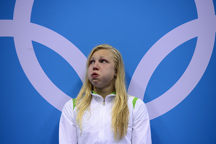 Olympic reactions: Lithuania's Ruta Meilutyte poses on the podium to receive the gold