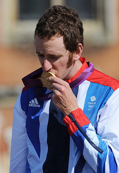 Tom Jenkins: Bradley Wiggins of Britain kisses his gold medal