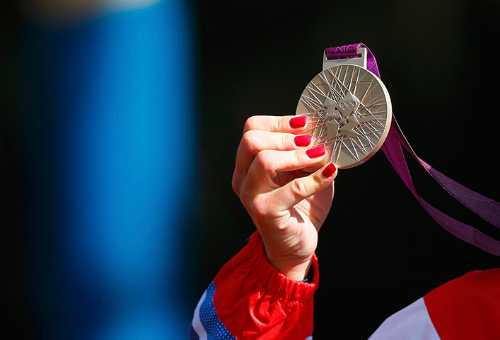 Nail art: Britain's Elizabeth Armitstead holds her silver medal 