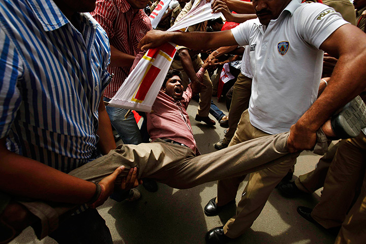 24 hours in pictures: Indian police detain an activist