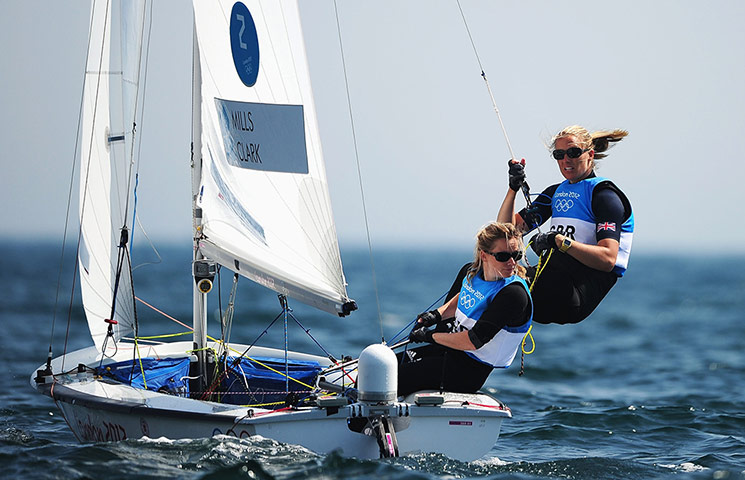 medals: Hannah Mills, left, and Saskia Clark on their way to the silver medal