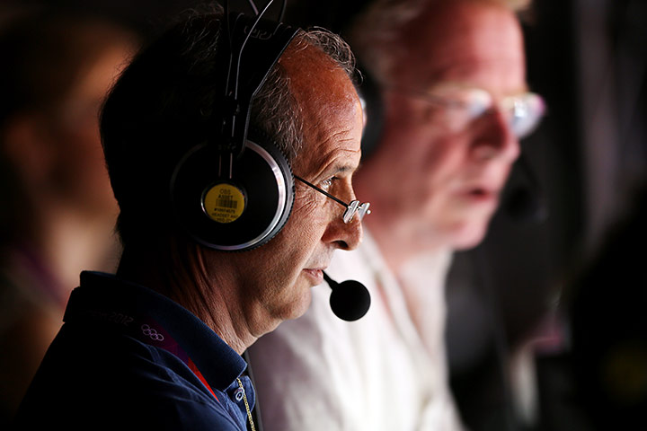 floor gymnastics: A journalist looks on from the top of the hall