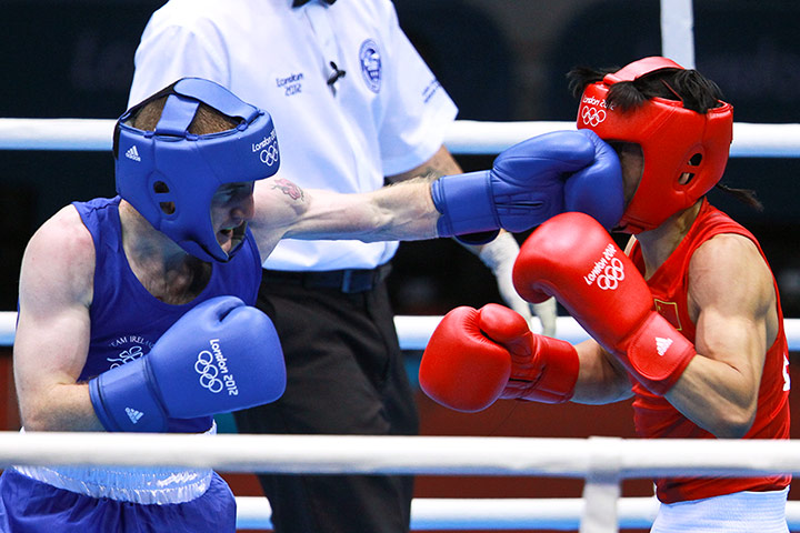 Boxing: Zou Shiming of China in red and Paddy Barnes of Ireland in Blue