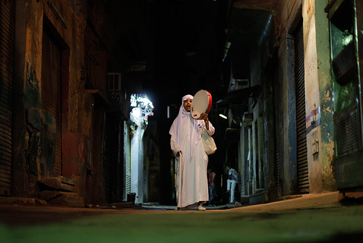 24 hours: Mohammed al Tonsi, 38, bangs a drum during Ramadan