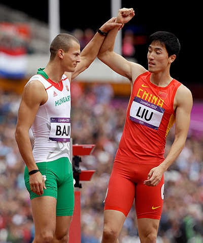 blunders gallery: China's Liu Xiang, right, and Hungary's Balazs Baji, 