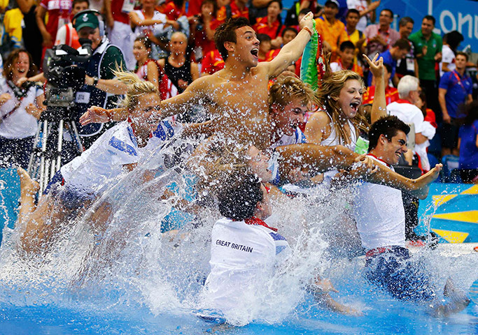 daley 2: Britain's Tom Daley is thrown into the pool 