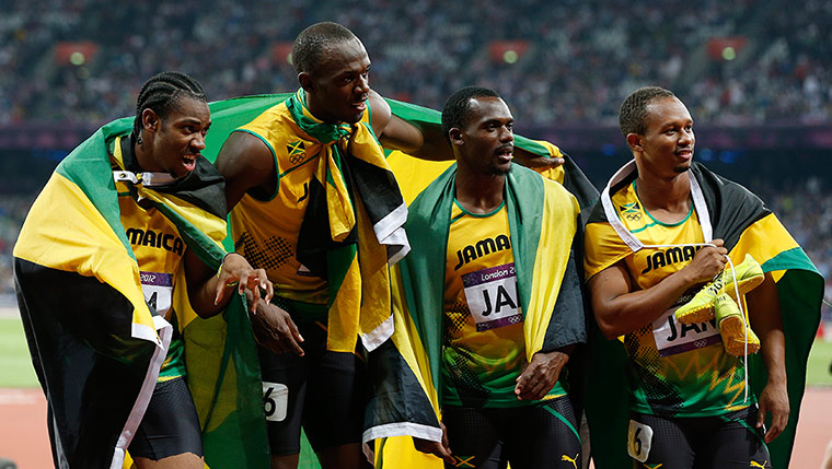 athletics final night: Usain Bolt of Jamaica and his team-mates win gold