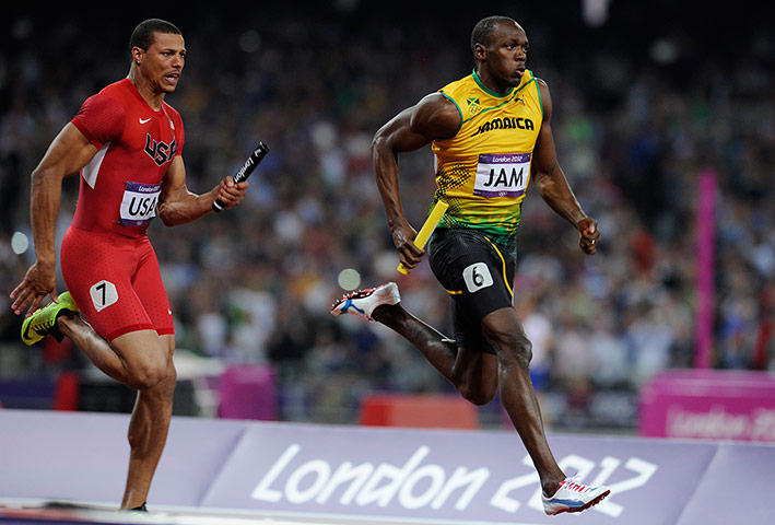 athletics final night: Usain Bolt of Jamaica crosses the line first ahead of Ryan Bailey of USA