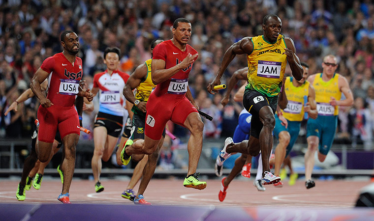 athletics final night: Usain Bolt of Jamaica crosses the line first ahead of Ryan Bailey of USA